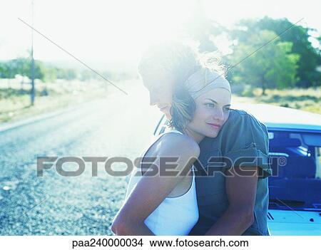 Couple hugging in road View Large Photo Image Picture - Couple hugging in road. Fotosearch