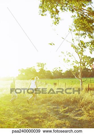 People walking in field View Large Photo Image Stock Photo - People walking in field. Fotosearch