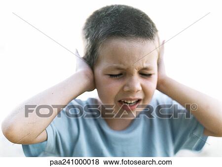 Boy with hands against ears, close-up View Large Photo Image Stock Photo - Boy with hands against ears, close-up. Fotosearch