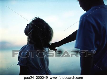 Child pulling other child's hair View Large Photo Image Stock Photo - Child pulling other child's hair. Fotosearch