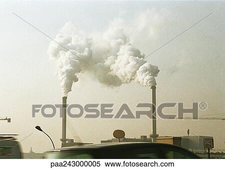 Stock Photography - Smokestacks emitting smoke. Fotosearch