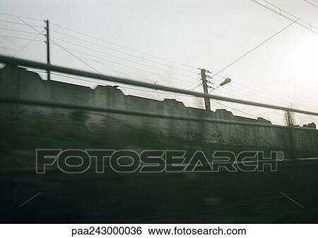 Stock Photograph - Sound wall and rail, blurred. Fotosearch