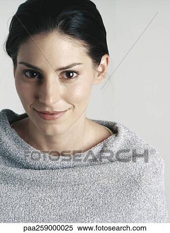 Young woman smiling at camera, close-up View Large Photo Image Stock Photography - Young woman smiling at camera, close-up. Fotosearch