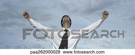 Man in front of sky with arms outstreched, waist up, front view View Large Photo Image Stock Photo - Man in front of sky with arms outstreched, waist up, front view. Fotosearch