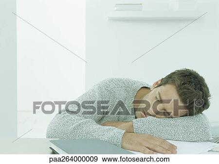 Man sleeping at table View Large Photo Image Stock Photo - Man sleeping at table. Fotosearch
