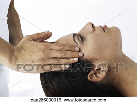Stock Photograph - Woman receiving head message, side view, close-up. Fotosearch