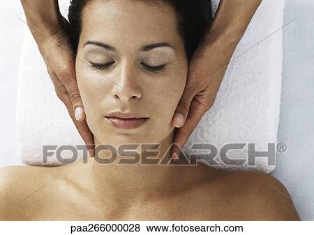 Woman with eyes closed and bare shoulders receiving neck massage View Large Photo Image Stock Photo - Woman with eyes closed and bare shoulders receiving neck massage. Fotosearch