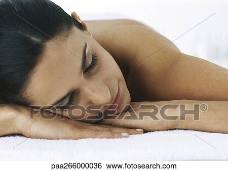 Woman with eyes closed, head on hands, close-up View Large Photo Image Stock Photograph - Woman with eyes closed, head on hands, close-up. Fotosearch