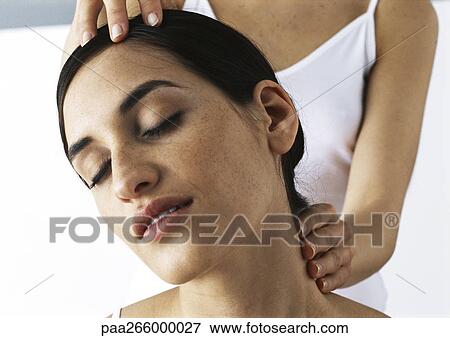 Woman with eyes closed receiving head and neck massage, close-up View Large Photo Image Stock Photo - Woman with eyes closed receiving head and neck massage, close-up. Fotosearch