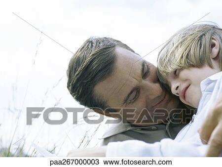 Boy and father hugging, head and shoulders View Large Photo Image Stock Image - Boy and father hugging, head and shoulders. Fotosearch