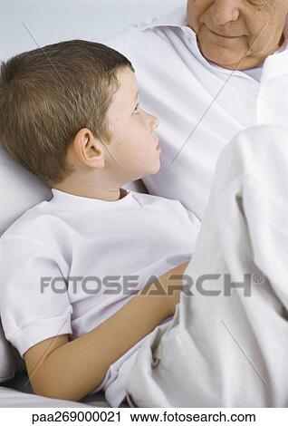 Boy looking up at grandfather View Large Photo Image Stock Image - Boy looking up at grandfather. Fotosearch