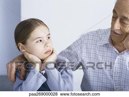 Grandfather with arm around girl View Large Photo Image Stock Photo - Grandfather with arm around girl. Fotosearch