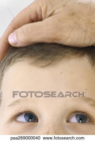 Grandmother's hand on boy's head, close-up View Large Photo Image Stock Image - Grandmother's hand on boy's head, close-up. Fotosearch