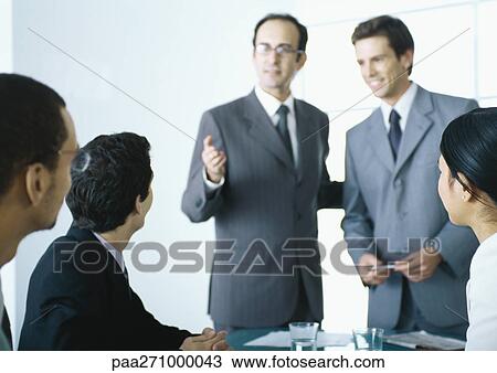 Stock Image - Businesspeople in meeting. Fotosearch