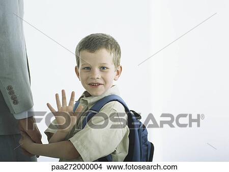 Picture - Boy holding man's hand, waving . Fotosearch