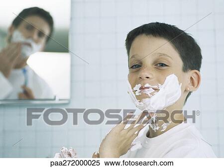 Boy with shaving cream on face and hands, man shaving in background View Large Photo Image Stock Photography - Boy with shaving cream on face and hands, man shaving in background. Fotosearch
