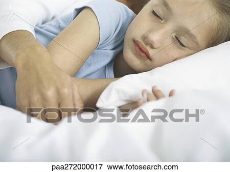 Girl sleeping with woman's arm over her View Large Photo Image Stock Photo - Girl sleeping with woman's arm over her. Fotosearch
