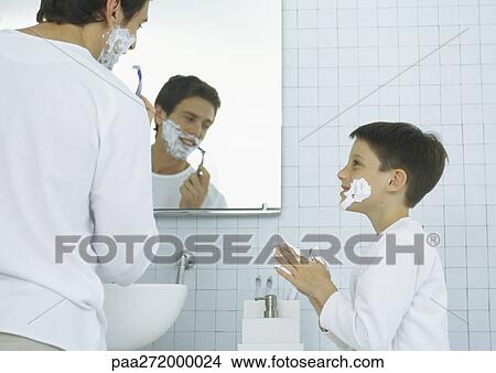 Man shaving, boy with shaving cream on face and hands View Large Photo Image Picture - Man shaving, boy with shaving cream on face and hands. Fotosearch