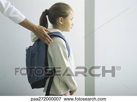 Woman's hand on shoulder of girl with backpack View Large Photo Image Stock Photo - Woman's hand on shoulder of girl with backpack. Fotosearch
