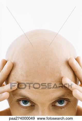 Man touching head, looking at camera, partial view, close-up View Large Photo Image Stock Photo - Man touching head, looking at camera, partial view, close-up. Fotosearch