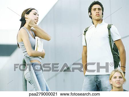 Stock Image - Students hanging out on campus. Fotosearch