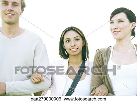 Stock Photograph - Three students arm in arm. Fotosearch