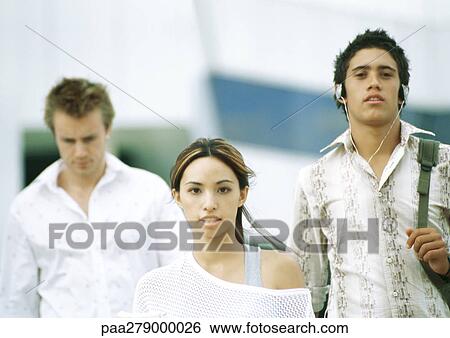 Three students walking View Large Photo Image Stock Photograph - Three students walking. Fotosearch