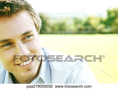 Young man smiling, close-up, portrait View Large Photo Image Stock Image - Young man smiling, close-up, portrait. Fotosearch
