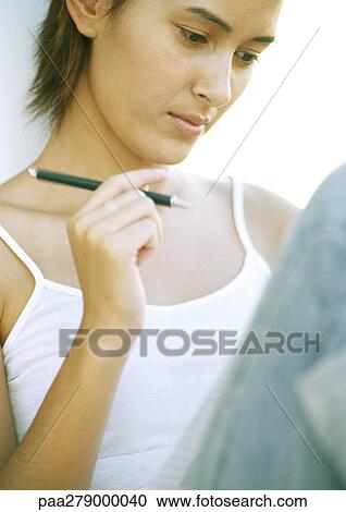 Young woman writing, close-up View Large Photo Image Stock Image - Young woman writing, close-up. Fotosearch
