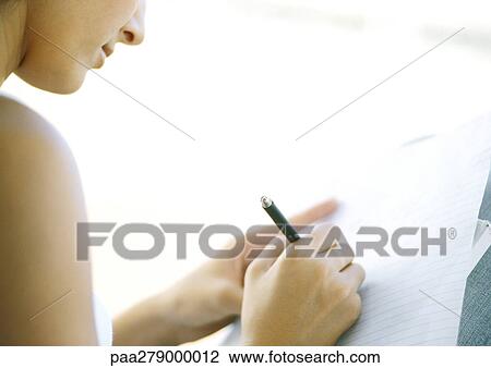 Young woman writing, partial view View Large Photo Image Stock Image - Young woman writing, partial view. Fotosearch