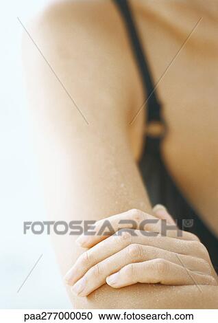 Woman's hand on her arm, close-up View Large Photo Image Stock Image - Woman's hand on her arm, close-up. Fotosearch