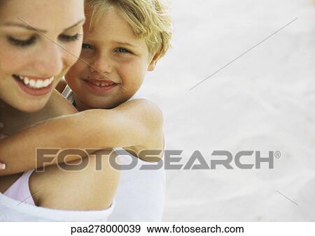 Boy and mother on beach, portrait View Large Photo Image Stock Photo - Boy and mother on beach, portrait. Fotosearch