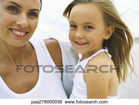 Girl and mother on beach, portrait View Large Photo Image Stock Photo - Girl and mother on beach, portrait. Fotosearch