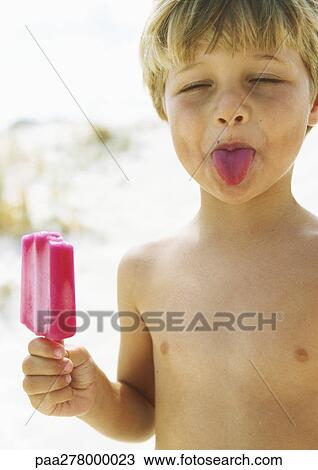 Little Boy With Popsicle Sticking Tongue Out With Eyes Closed Stock Image Paa Fotosearch