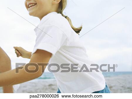 Little girl running on beach View Large Photo Image Stock Photograph - Little girl running on beach. Fotosearch