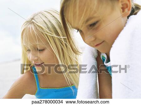 Two little girls on beach View Large Photo Image Picture - Two little girls on beach. Fotosearch