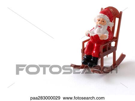 Toy Santa Claus in rocking chair View Large Photo Image Stock Photo - Toy Santa Claus in rocking chair. Fotosearch