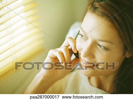 Woman using cell phone, close-up View Large Photo Image Stock Photo - Woman using cell phone, close-up. Fotosearch