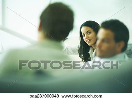 Young adults engaged in discussion View Large Photo Image Stock Photo - Young adults engaged in discussion. Fotosearch