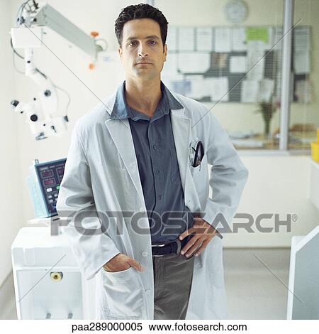 Doctor standing in front of medical equipment View Large Photo Image Stock Photography - Doctor standing in front of medical equipment. Fotosearch