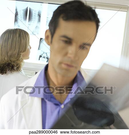 Doctors in x-ray lab View Large Photo Image Stock Photograph - Doctors in x-ray lab. Fotosearch