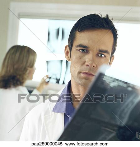 Doctors in x-ray lab View Large Photo Image Stock Photography - Doctors in x-ray lab. Fotosearch
