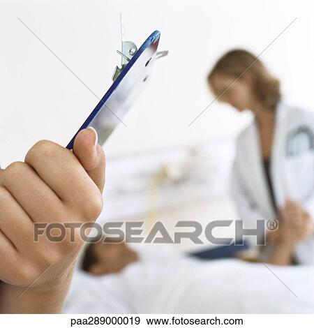 Doctors visiting patient View Large Photo Image Stock Photo - Doctors visiting patient. Fotosearch