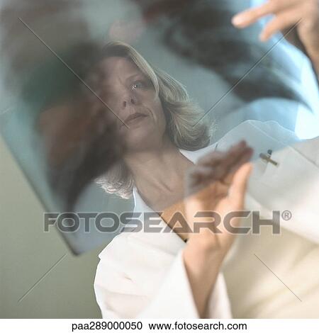 Female doctor in x-ray lab View Large Photo Image Stock Image - Female doctor in x-ray lab. Fotosearch