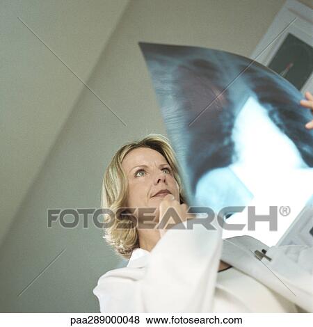 Female doctor in x-ray lab View Large Photo Image Stock Photo - Female doctor in x-ray lab. Fotosearch