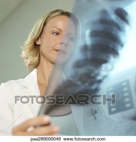 Female doctor in x-ray lab View Large Photo Image Stock Photo - Female doctor in x-ray lab. Fotosearch