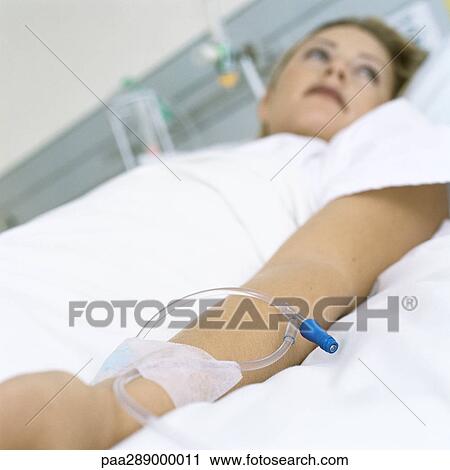 Female patient lying in hospital bed View Large Photo Image Stock Image - Female patient lying in hospital bed. Fotosearch