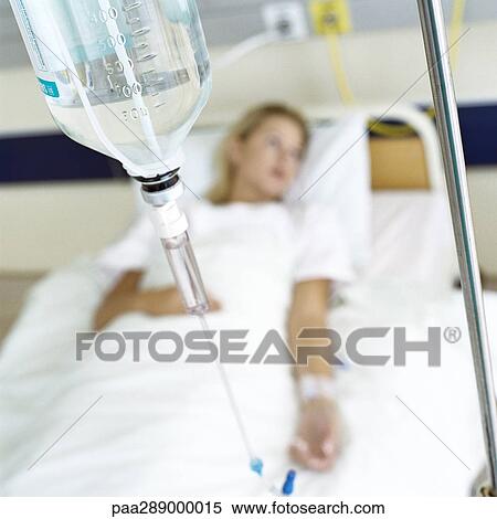 IV and female patient lying in hospital bed View Large Photo Image Stock Photography - IV and female patient lying in hospital bed. Fotosearch