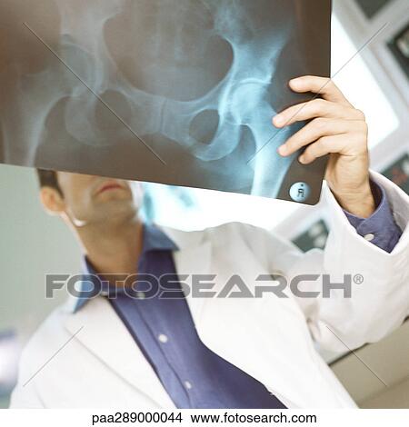 Picture - Male doctor in x-ray lab. Fotosearch
