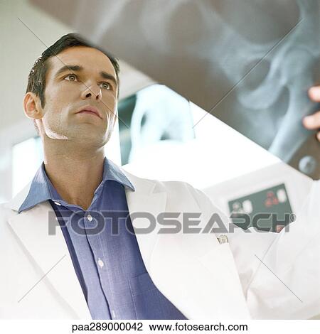 Male doctor in x-ray lab View Large Photo Image Stock Image - Male doctor in x-ray lab. Fotosearch